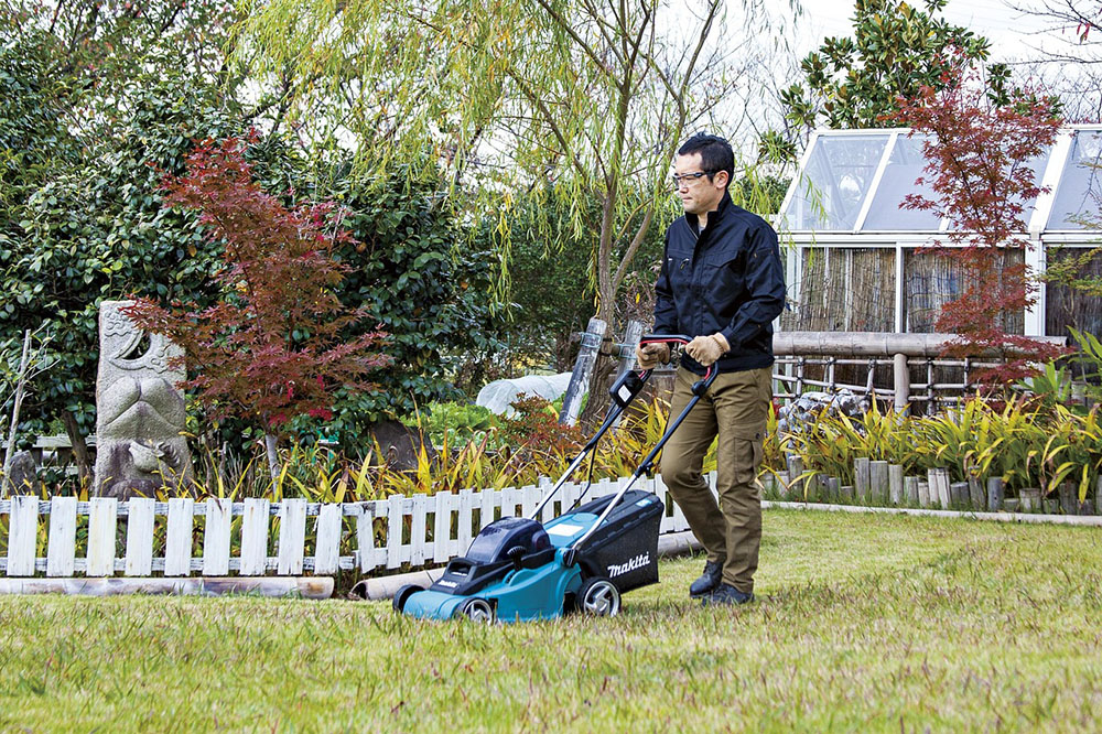 Landscaper using leaf blower Landscaper using leaf blower